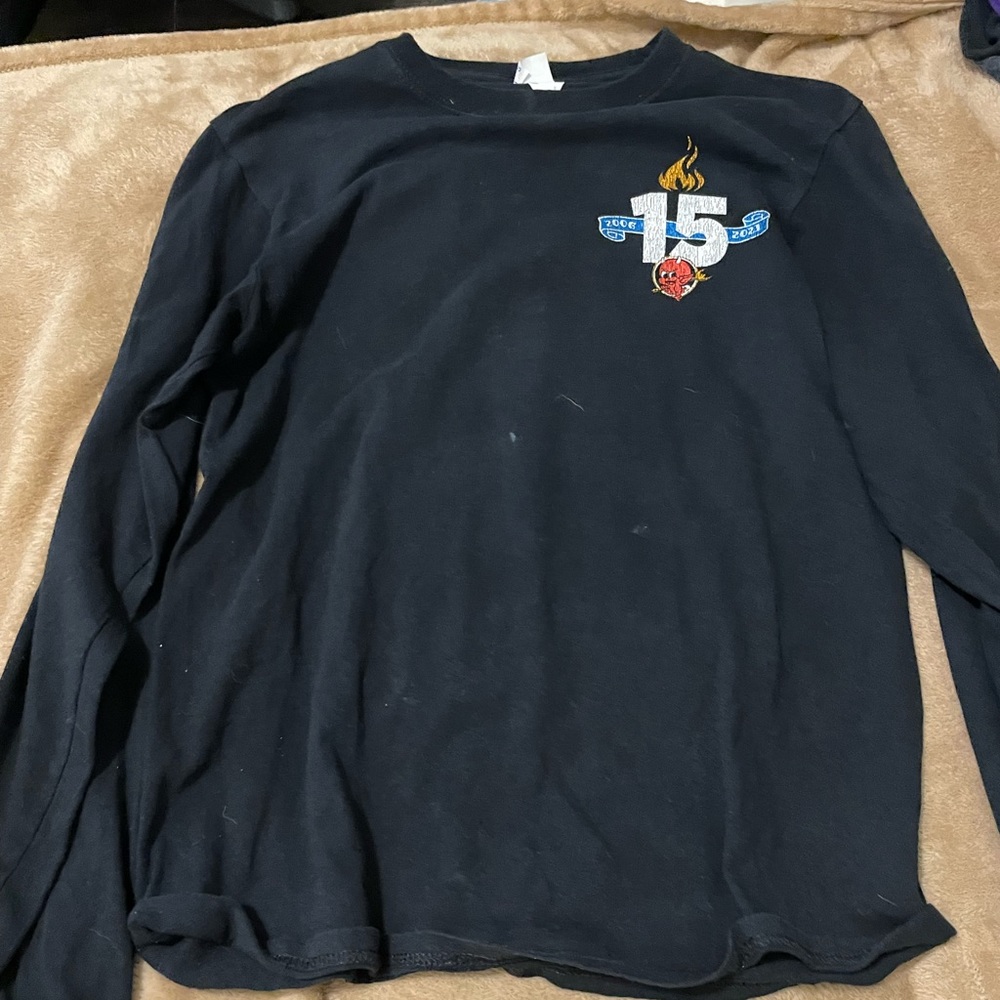 Long sleeve torches tacos t shirt runs big in size